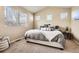 Comfortable main bedroom with a neutral color scheme and large windows at 12185 S Grass River Trl, Parker, CO 80134