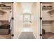 Spacious walk-in closet leading to a luxurious bathroom with a soaking tub and natural light at 12185 S Grass River Trl, Parker, CO 80134