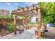 Relaxing backyard features a wooden pergola that covers an outdoor seating area with a rug at 434 N Washington St, Denver, CO 80203