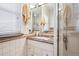 Bathroom vanity with granite countertop, mirrored wall, and decorative tile at 434 N Washington St, Denver, CO 80203