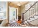 Inviting foyer featuring a staircase, wooden floors, and decorative lighting fixture at 434 N Washington St, Denver, CO 80203