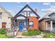 Charming brick home with blue front door and well-maintained landscaping at 434 N Washington St, Denver, CO 80203