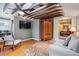 Comfortable living space with exposed beams, wood flooring, a ceiling fan, and a cozy seating area at 434 N Washington St, Denver, CO 80203