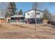 Expansive backyard featuring a patio area and lush lawn, perfect for outdoor activities at 8229 Marshall Ct, Arvada, CO 80003