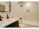 Bathroom featuring vanity, and tiled shower with built-in niche at 8229 Marshall Ct, Arvada, CO 80003
