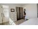 Bedroom featuring luxury vinyl plank flooring and access to the bathroom at 8229 Marshall Ct, Arvada, CO 80003