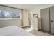 Bedroom filled with natural light, featuring luxury vinyl plank flooring and a spacious closet at 8229 Marshall Ct, Arvada, CO 80003
