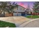 Attractive two-story home boasting a spacious driveway and lush front yard at 8229 Marshall Ct, Arvada, CO 80003