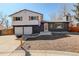 Charming two-story home with a well-maintained lawn and inviting curb appeal at 8229 Marshall Ct, Arvada, CO 80003