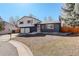 Charming two-story home with a well-maintained lawn and inviting curb appeal at 8229 Marshall Ct, Arvada, CO 80003