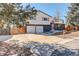 Charming two-story home featuring a spacious driveway and a two-car garage at 8229 Marshall Ct, Arvada, CO 80003