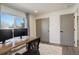 Home office featuring modern desk, monitors, window and updated closet at 8229 Marshall Ct, Arvada, CO 80003