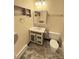 Bathroom featuring a vanity with drawers, mirror, and a toilet at 7309 W Hampden Ave # 5202, Lakewood, CO 80227