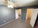 Cozy bedroom featuring a ceiling fan, radiator, and a window with natural light at 7309 W Hampden Ave # 5202, Lakewood, CO 80227