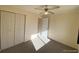 Cozy bedroom with a ceiling fan, closet, and natural light at 7309 W Hampden Ave # 5202, Lakewood, CO 80227