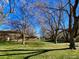 Community featuring green common area with mature trees at 7309 W Hampden Ave # 5202, Lakewood, CO 80227