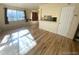 Bright living room featuring recently refinished hardwood floors and ample natural light at 7309 W Hampden Ave # 5202, Lakewood, CO 80227