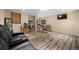 Basement featuring retro arcade games, a black couch, and a mounted television at 871 S Joplin Cir, Aurora, CO 80017
