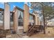 Townhome exterior with a charming deck and well-maintained landscaping at 871 S Joplin Cir, Aurora, CO 80017