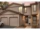 Charming townhome with a two-car garage and neutral siding under a colorful sunset at 871 S Joplin Cir, Aurora, CO 80017