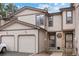 Charming townhome with a two-car garage and neutral siding under a sunny sky at 871 S Joplin Cir, Aurora, CO 80017
