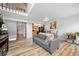 View of the bright living space showing staircase and open access to the kitchen at 871 S Joplin Cir, Aurora, CO 80017