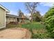 Spacious backyard with a shed and mature trees, offering privacy and outdoor enjoyment at 4788 Briar Ridge Trl, Boulder, CO 80301