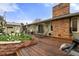 Backyard featuring a wood deck, brick accents, and outdoor seating, perfect for entertaining at 4788 Briar Ridge Trl, Boulder, CO 80301