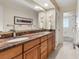 Stylish bathroom features a double vanity with granite countertop, and modern fixtures at 4788 Briar Ridge Trl, Boulder, CO 80301