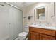 Bathroom featuring a glass-enclosed shower, modern fixtures, and a cherry vanity providing a serene and functional space at 4788 Briar Ridge Trl, Boulder, CO 80301
