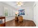 Bedroom featuring a built-in desk, plantation shutters, and hardwood floors, ideal for a home office or guest room at 4788 Briar Ridge Trl, Boulder, CO 80301