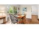 Bright dining area with natural light, hardwood floors, and access to the outdoor deck through sliding glass doors at 4788 Briar Ridge Trl, Boulder, CO 80301