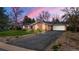 Charming stone exterior home with an attached two car garage and long asphalt driveway at 4788 Briar Ridge Trl, Boulder, CO 80301
