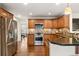 Modern kitchen boasts stainless steel appliances, granite countertops, and custom cabinetry at 4788 Briar Ridge Trl, Boulder, CO 80301