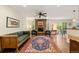 Cozy living room with stone fireplace, plush seating, and hardwood floors at 4788 Briar Ridge Trl, Boulder, CO 80301