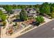 Beautiful two-story home with solar panels, manicured landscaping, and mature trees on a corner lot at 21395 E Greenwood Pl, Aurora, CO 80013