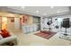 Finished basement area with bar seating and workout equipment at 21395 E Greenwood Pl, Aurora, CO 80013