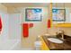 Bathroom featuring yellow cabinets and a shower/tub at 21395 E Greenwood Pl, Aurora, CO 80013