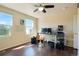 Bedroom featuring dark hardwood floors and natural light at 21395 E Greenwood Pl, Aurora, CO 80013