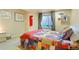 Bedroom featuring light walls, carpet and an egress window at 21395 E Greenwood Pl, Aurora, CO 80013