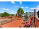 A cozy wood deck shows outdoor seating and lovely landscaping at 21395 E Greenwood Pl, Aurora, CO 80013