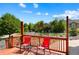A cozy wood deck includes outdoor seating and a view of the landscape at 21395 E Greenwood Pl, Aurora, CO 80013