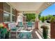 Charming front porch with seating, decor, and views of the surrounding landscape at 21395 E Greenwood Pl, Aurora, CO 80013