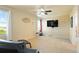 Living room featuring neutral walls and carpet with a wall-mounted tv at 21395 E Greenwood Pl, Aurora, CO 80013