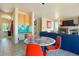 Inviting living room with a fireplace and easy access to kitchen at 21395 E Greenwood Pl, Aurora, CO 80013