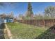Large, fenced backyard with lush lawn is perfect for outdoor activities and Gathering fun at 2252 S Lafayette St, Denver, CO 80210