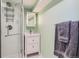 Modern bathroom features a glass shower, vanity with storage, and sleek hardware at 2252 S Lafayette St, Denver, CO 80210