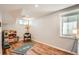 Bright bedroom with wood floors, ample natural light, and a charming play kitchen at 2252 S Lafayette St, Denver, CO 80210