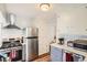Modern kitchen with stainless steel appliances, white subway tile backsplash, and ample cabinet space at 2252 S Lafayette St, Denver, CO 80210