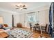 Bright living space with hardwood floors, a dining table, and a cozy sitting area for relaxation at 2252 S Lafayette St, Denver, CO 80210
